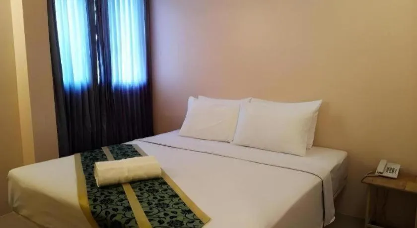 Bed in BIRD ROOM HOTEL - PRATUNAM