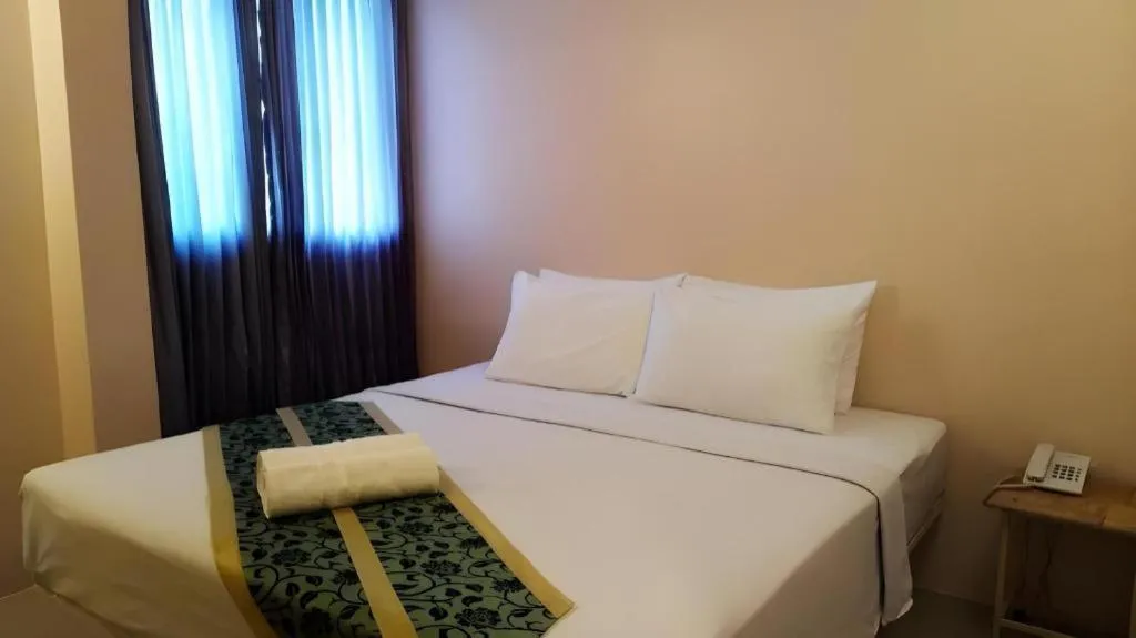 Bed in BIRD ROOM HOTEL - PRATUNAM