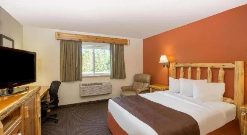 Bed in AmericInn by Wyndham Pequot Lakes