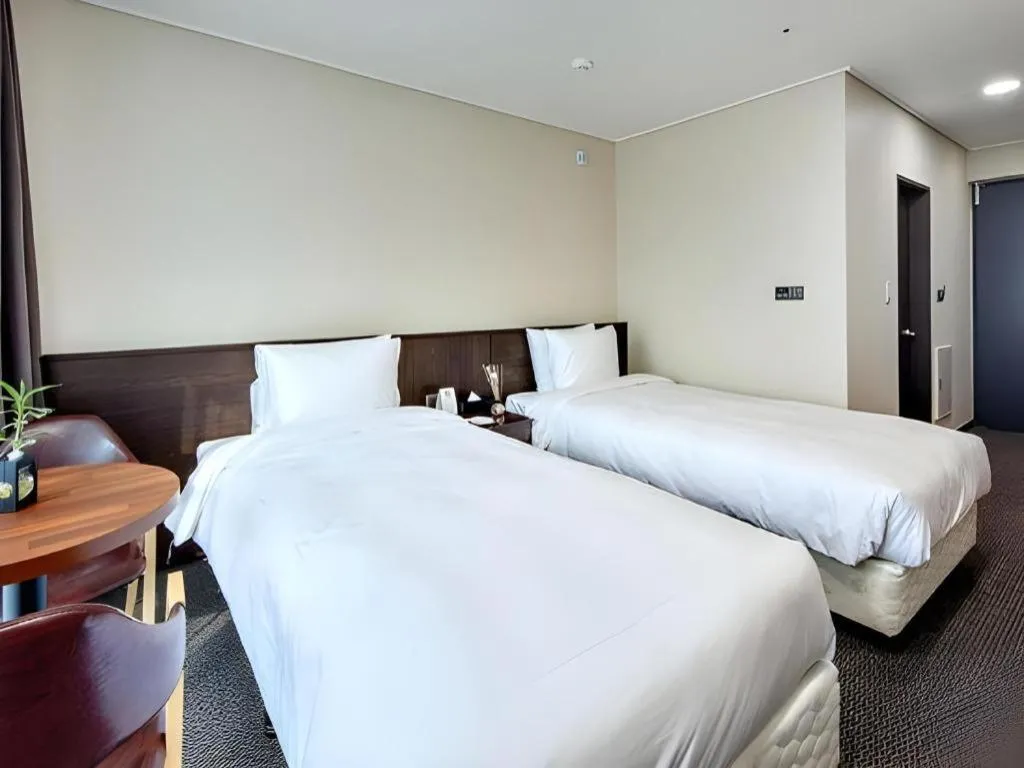 Bed in Riviera Incheon Airport Hotel