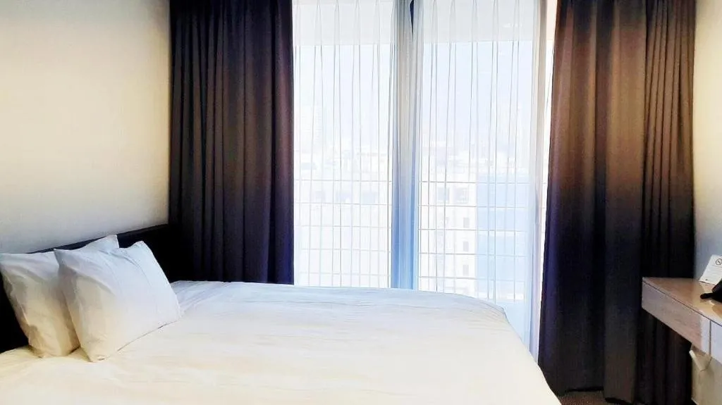 Bed in Riviera Incheon Airport Hotel