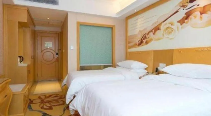 Bed in Vienna Hotel Guangdong Qingyuan Wanda Plaza Xincheng Beijiang