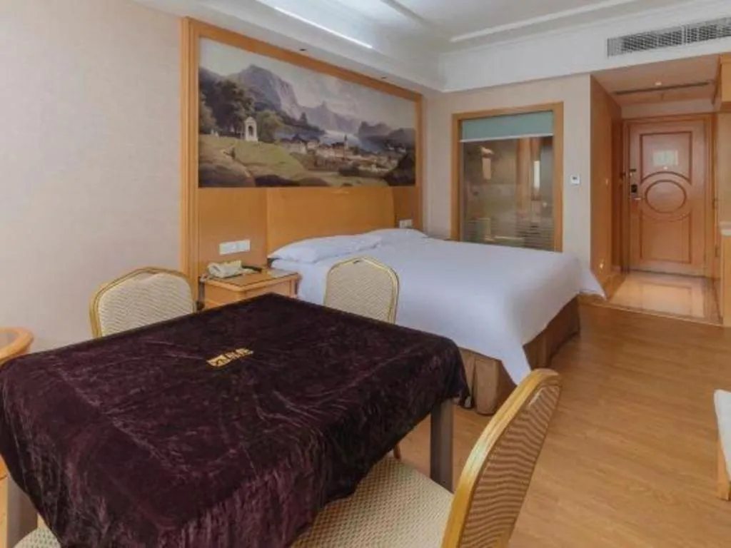 Bed in Vienna Hotel Guangdong Qingyuan Wanda Plaza Xincheng Beijiang