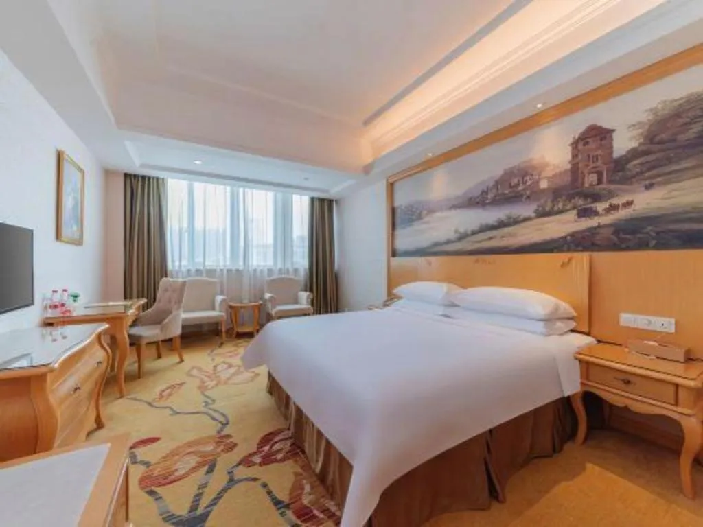 Bed in Vienna Hotel Guangdong Qingyuan Wanda Plaza Xincheng Beijiang