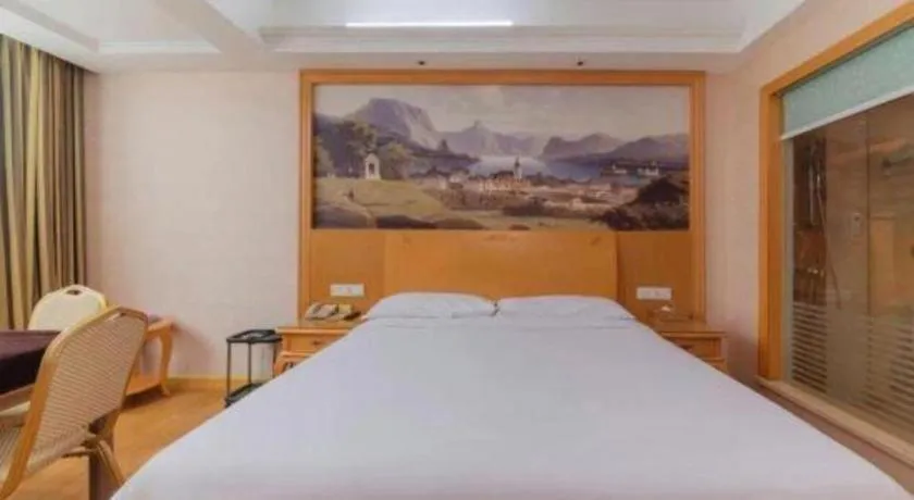Bed in Vienna Hotel Guangdong Qingyuan Wanda Plaza Xincheng Beijiang
