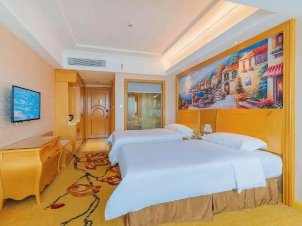 Bed in Vienna Hotel Guangdong Qingyuan Wanda Plaza Xincheng Beijiang