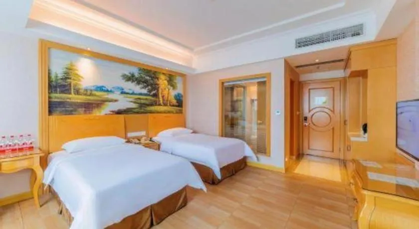 Bed in Vienna Hotel Guangdong Qingyuan Wanda Plaza Xincheng Beijiang