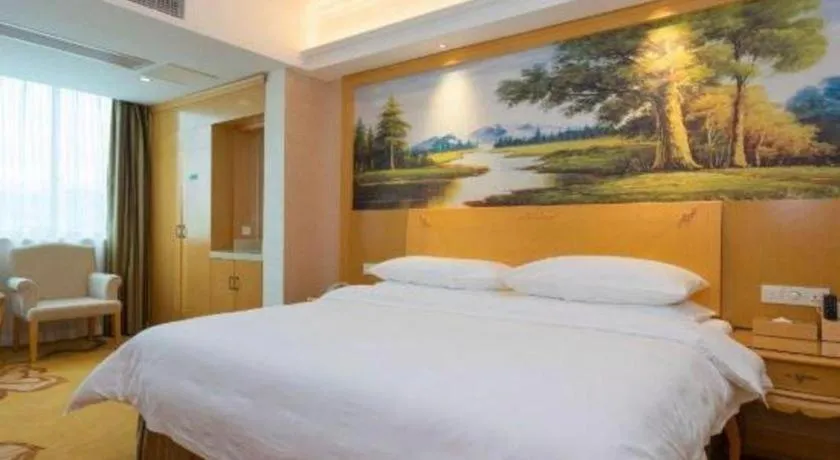 Bed in Vienna Hotel Guangdong Qingyuan Wanda Plaza Xincheng Beijiang