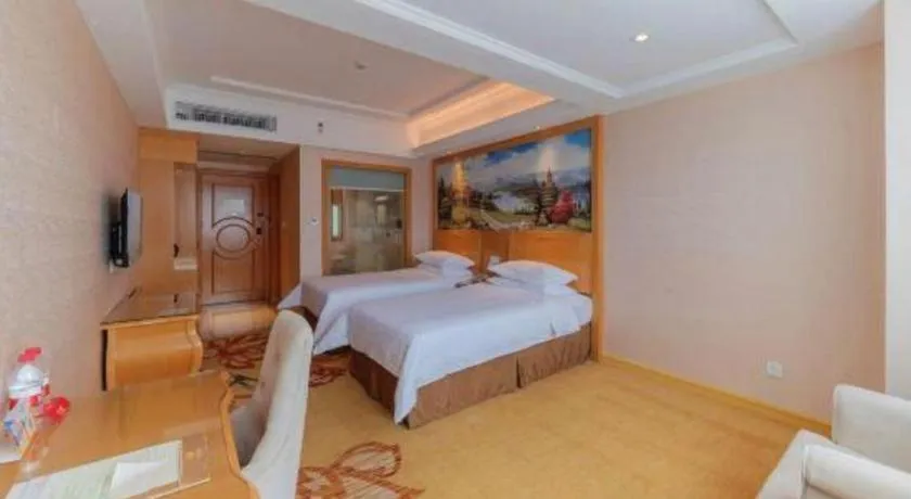 Bed in Vienna Hotel Guangdong Qingyuan Wanda Plaza Xincheng Beijiang