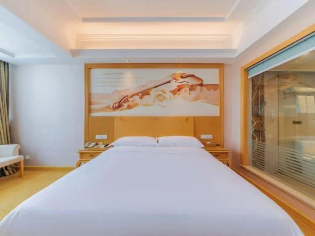 Bed in Vienna Hotel Guangdong Qingyuan Wanda Plaza Xincheng Beijiang