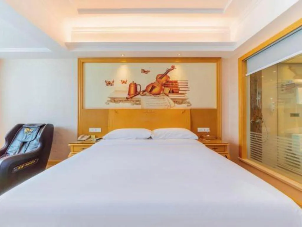 Bed in Vienna Hotel Guangdong Qingyuan Wanda Plaza Xincheng Beijiang