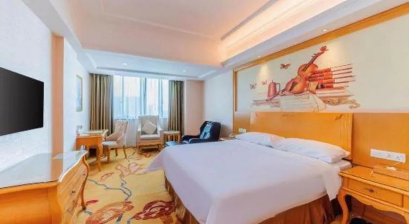 Bed in Vienna Hotel Guangdong Qingyuan Wanda Plaza Xincheng Beijiang