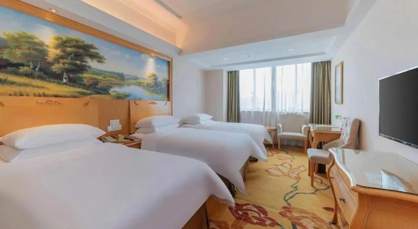Bed in Vienna Hotel Guangdong Qingyuan Wanda Plaza Xincheng Beijiang