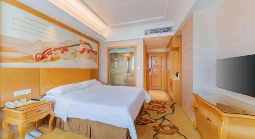 Bed in Vienna Hotel Guangdong Qingyuan Wanda Plaza Xincheng Beijiang