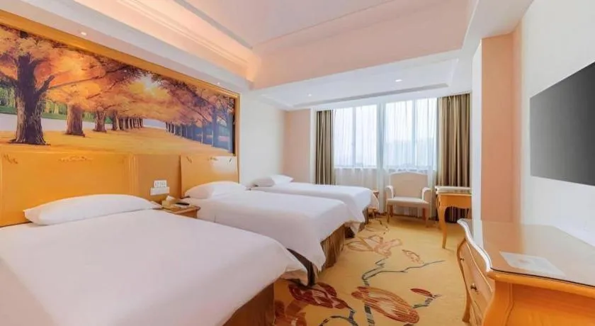 Bed in Vienna Hotel Guangdong Qingyuan Wanda Plaza Xincheng Beijiang