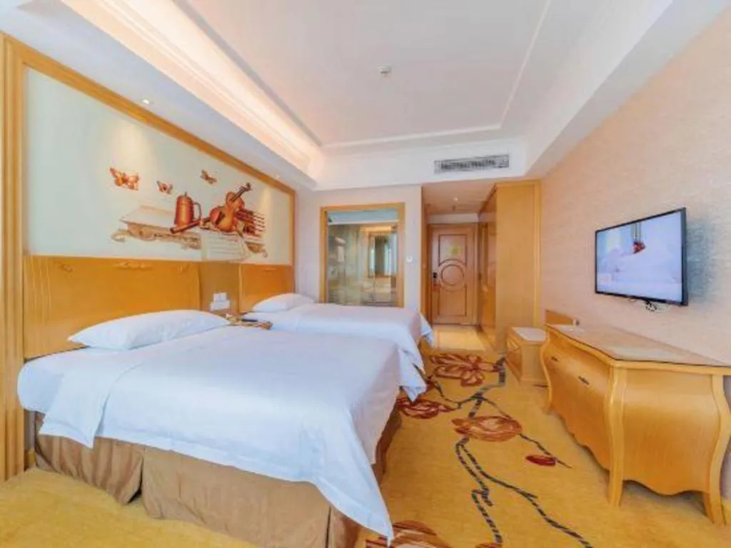 Bed in Vienna Hotel Guangdong Qingyuan Wanda Plaza Xincheng Beijiang