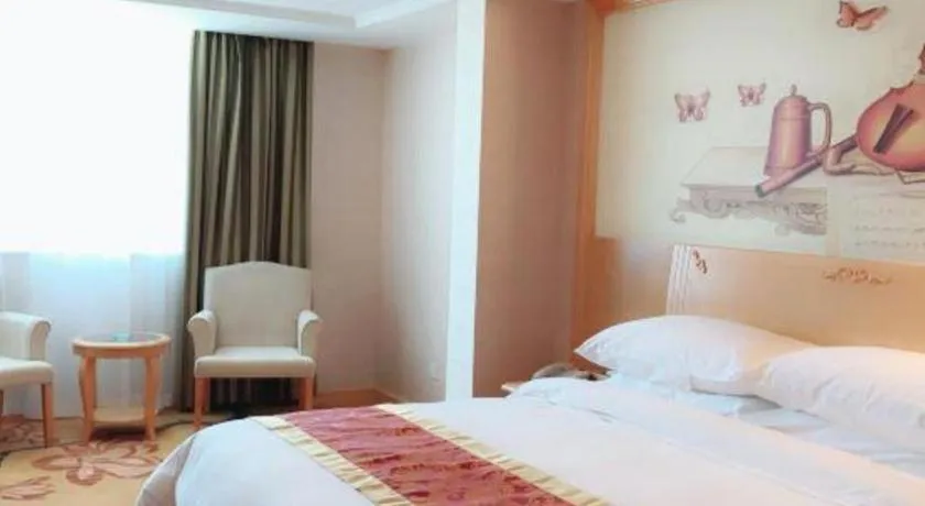 Bed in Vienna Hotel Guangdong Qingyuan Wanda Plaza Xincheng Beijiang