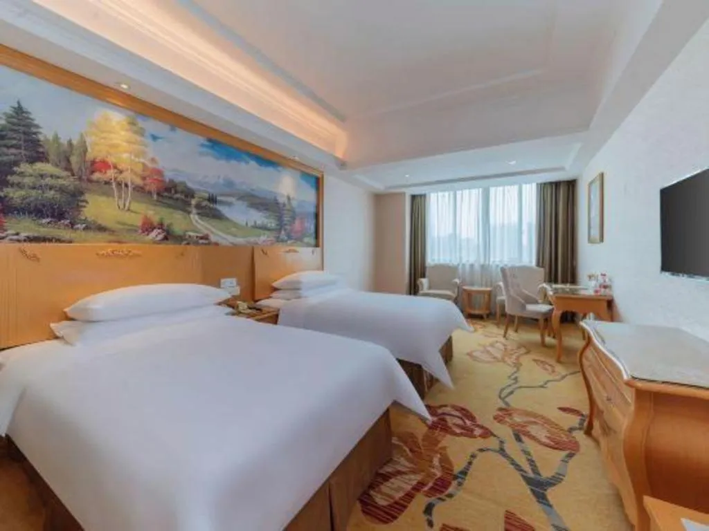 Bed in Vienna Hotel Guangdong Qingyuan Wanda Plaza Xincheng Beijiang