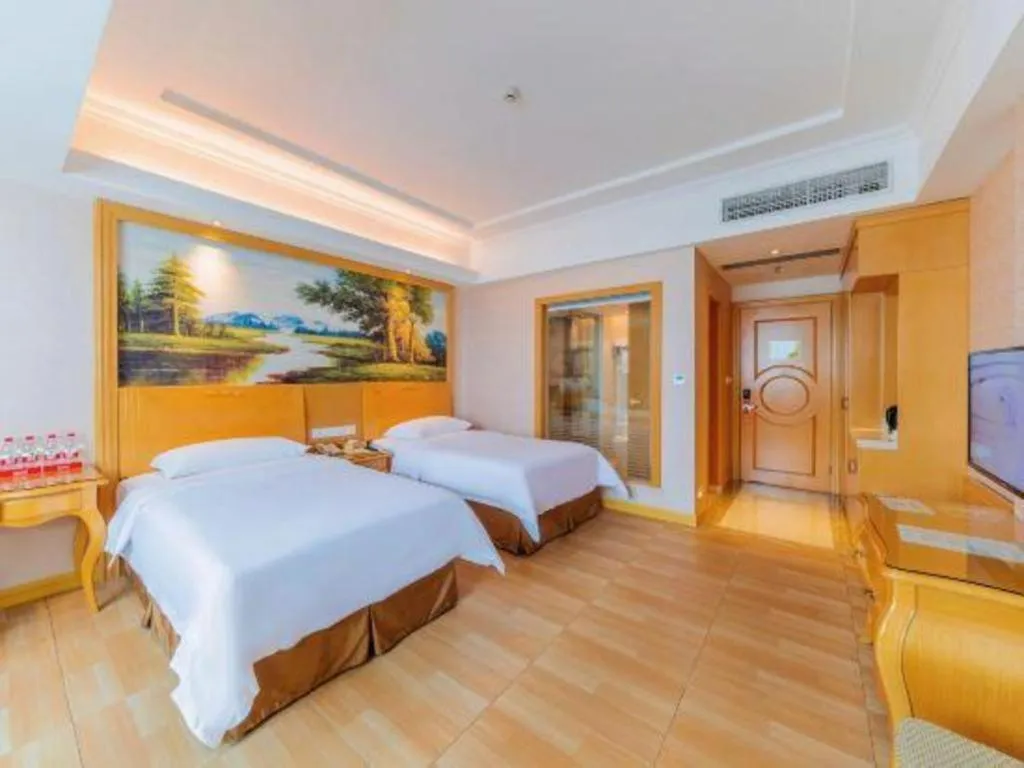 Bed in Vienna Hotel Guangdong Qingyuan Wanda Plaza Xincheng Beijiang