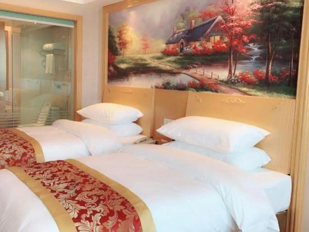 Bed in Vienna Hotel Guangdong Qingyuan Wanda Plaza Xincheng Beijiang