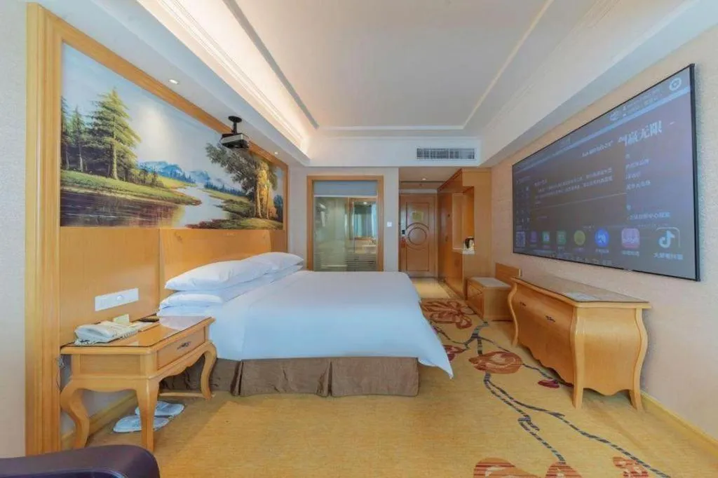 Bed in Vienna Hotel Guangdong Qingyuan Wanda Plaza Xincheng Beijiang
