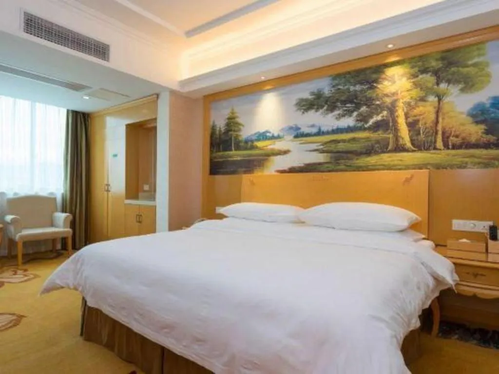 Bed in Vienna Hotel Guangdong Qingyuan Wanda Plaza Xincheng Beijiang