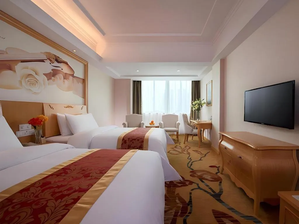 Bed in Vienna Hotel Guangdong Qingyuan Wanda Plaza Xincheng Beijiang