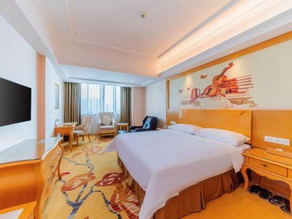 Bed in Vienna Hotel Guangdong Qingyuan Wanda Plaza Xincheng Beijiang