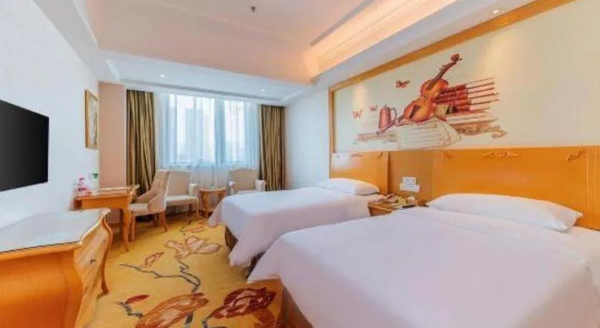 Bed in Vienna Hotel Guangdong Qingyuan Wanda Plaza Xincheng Beijiang