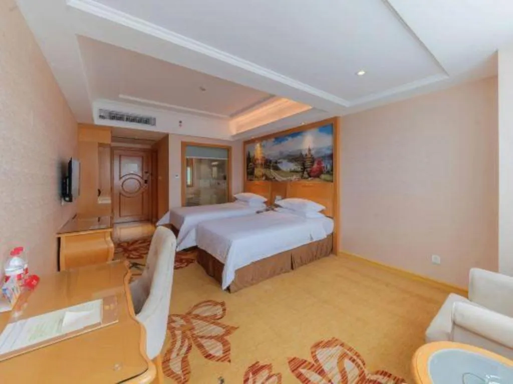 Bed in Vienna Hotel Guangdong Qingyuan Wanda Plaza Xincheng Beijiang