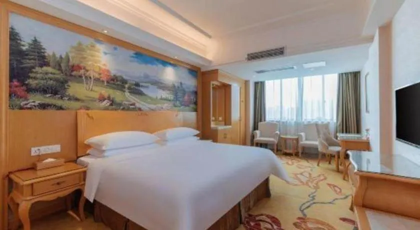 Bed in Vienna Hotel Guangdong Qingyuan Wanda Plaza Xincheng Beijiang