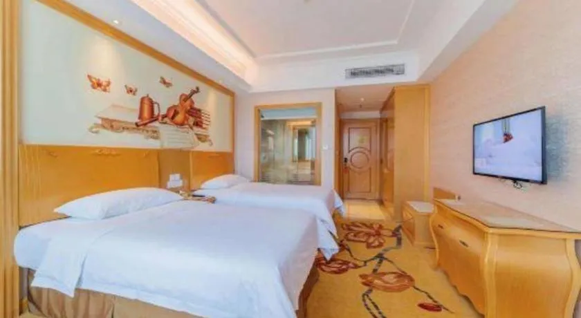 Bed in Vienna Hotel Guangdong Qingyuan Wanda Plaza Xincheng Beijiang