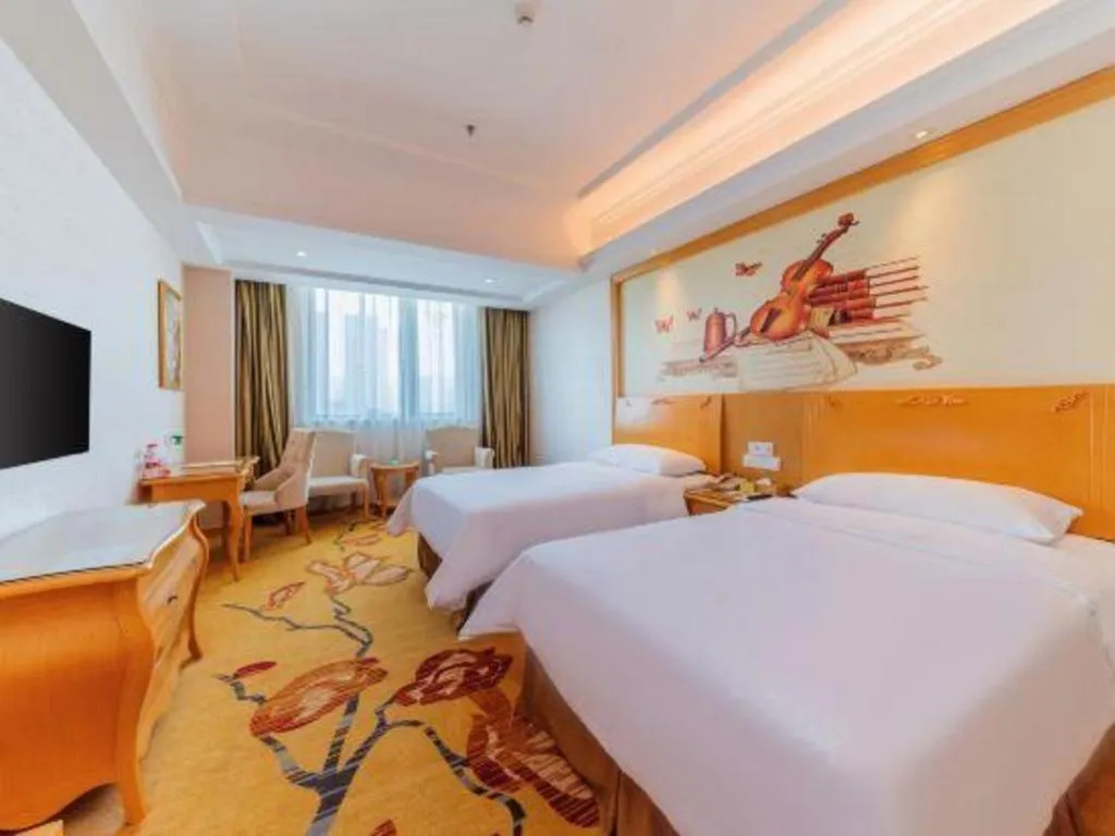 Bed in Vienna Hotel Guangdong Qingyuan Wanda Plaza Xincheng Beijiang