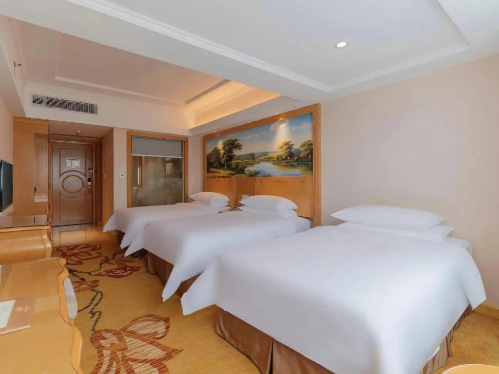 Bed in Vienna Hotel Guangdong Qingyuan Wanda Plaza Xincheng Beijiang
