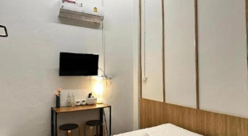 Bed in Sirichai Design Hotel