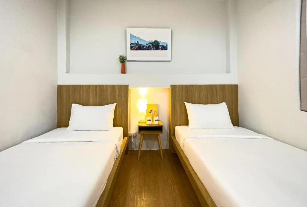 Bed in Sirichai Design Hotel