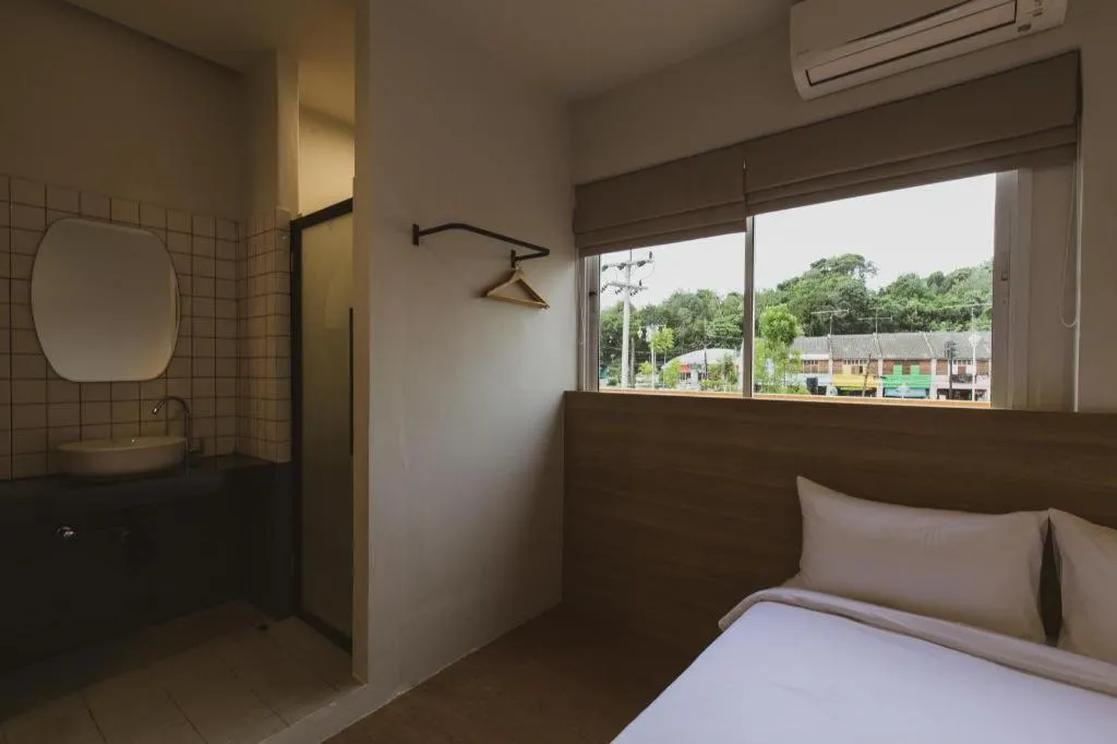 Bed in Sirichai Design Hotel