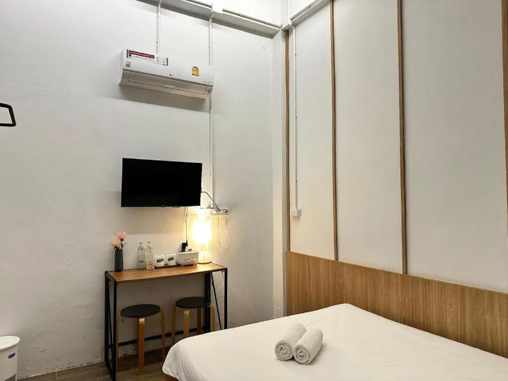 Bed in Sirichai Design Hotel