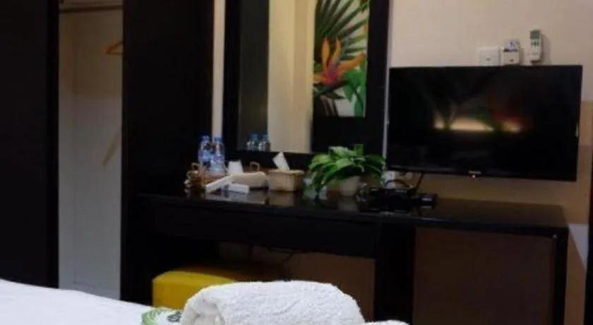 Bed in Tropical Point Hotel Syariah