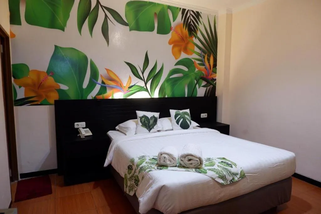 Bed in Tropical Point Hotel Syariah