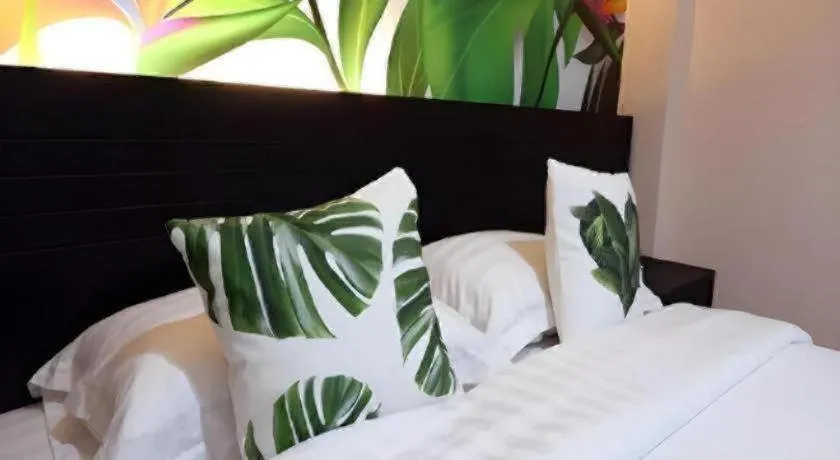 Bed in Tropical Point Hotel Syariah