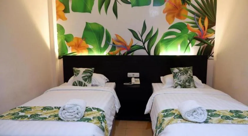 Bed in Tropical Point Hotel Syariah