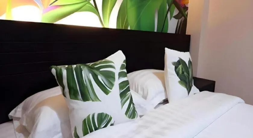 Bed in Tropical Point Hotel Syariah