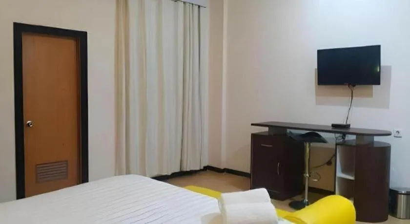 Bed in Tropical Point Hotel Syariah