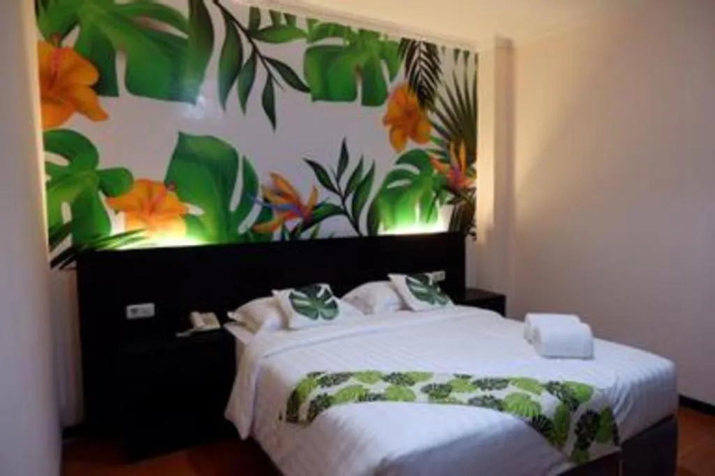 Bed in Tropical Point Hotel Syariah