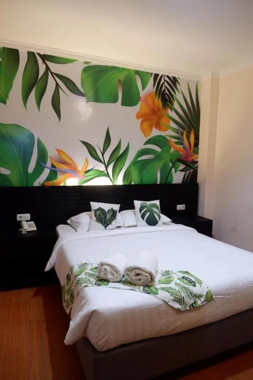 Bed in Tropical Point Hotel Syariah