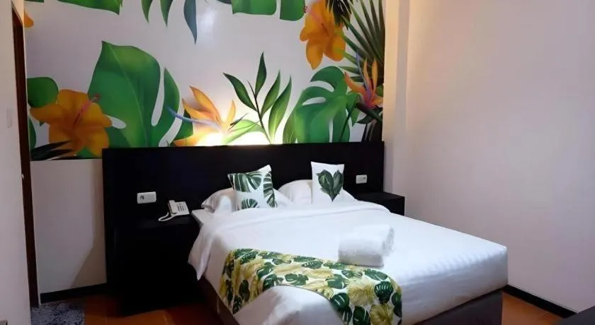 Bed in Tropical Point Hotel Syariah