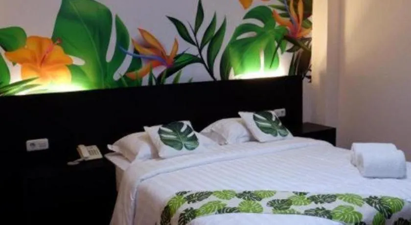 Bed in Tropical Point Hotel Syariah