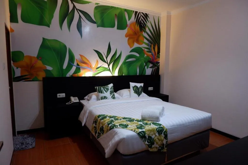 Bed in Tropical Point Hotel Syariah