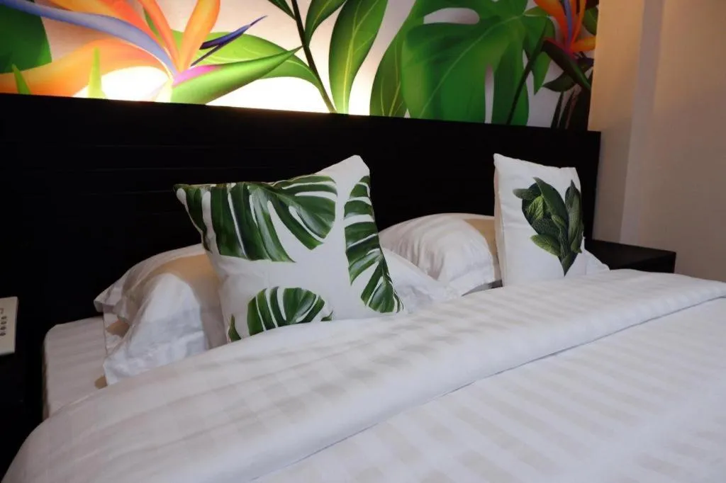 Bed in Tropical Point Hotel Syariah